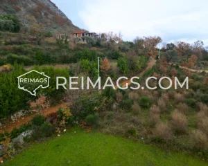 Large green flat plot near the road with a sea view in Dobra Voda, Bar.